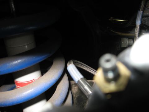 1978 Ford Mustang II - Close-up of vehicle suspension parts, including coil springs and a shock absorber.
