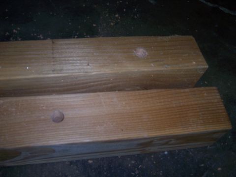 1991 Ford Bronco - Two wooden beams are shown with dowel plugs on their surfaces.
