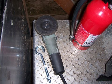 1991 Ford Bronco - Angle grinder and fire extinguisher are visible on a diamond plate surface.