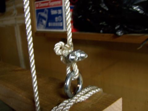1991 Ford Bronco - A close-up view of a rope and hardware assembly, likely part of a lifting or storage system.