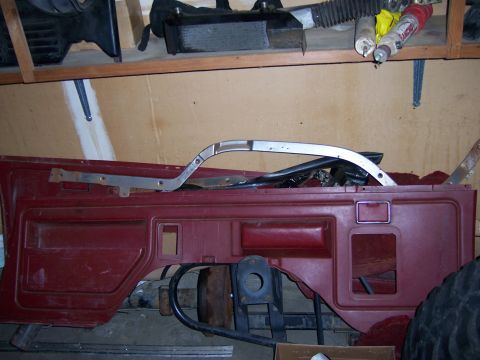 1991 Ford Bronco - Disassembled car interior part, possibly a door panel, with visible trim pieces.