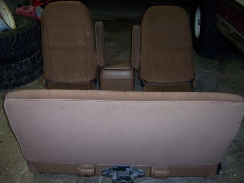 1991 Ford Bronco - Interior car seats and console are shown from the rear.