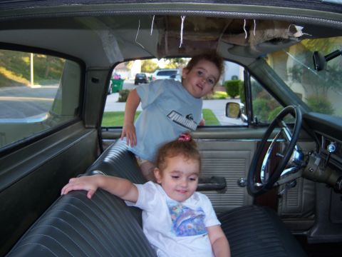 1967 Ford Ranchero - Two children are inside the interior of a 1967 Ford Ranchero.