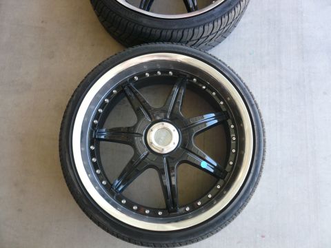 1996 Ford Probe - A close-up view of two custom car wheels and tires, likely aftermarket parts.