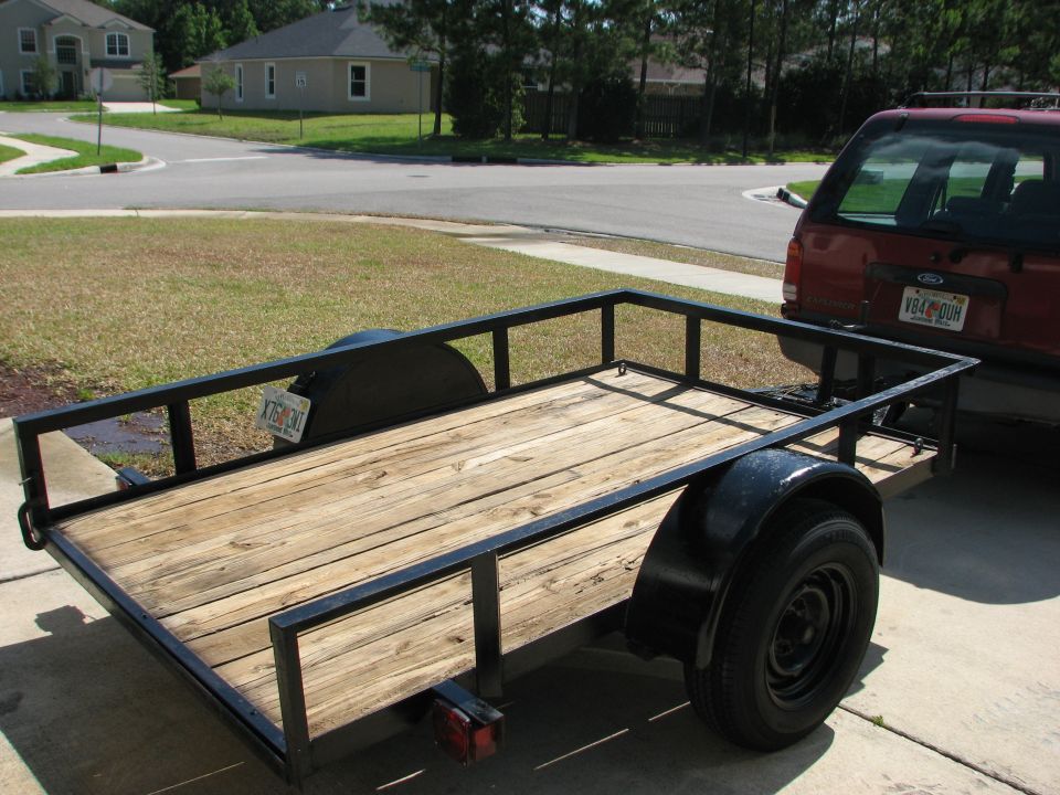 Trailer hitched to a red SUV
