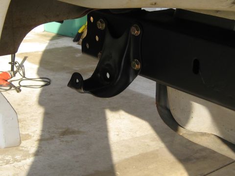 1996 Ford Bronco - A close-up view of a vehicle's frame and a newly installed bracket.