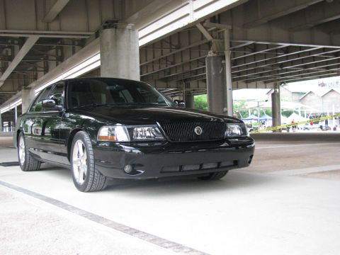 2003 Mercury Marauder - A black 2003 Mercury Marauder is parked under an overpass.