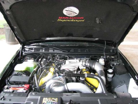2003 Mercury Marauder - Engine bay of a 2003 Mercury Marauder, highlighting its supercharged engine setup.