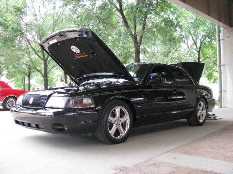 2003 Mercury Marauder - Black 2003 Mercury Marauder at a car show, hood and trunk open.
