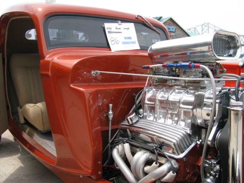 2003 Mercury Marauder - A 1933 Ford Coupe hot rod is displayed with its powerful engine visible.