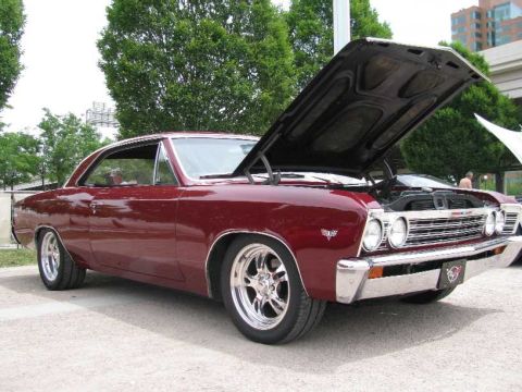 2003 Mercury Marauder - Maroon 1966 Chevrolet Chevelle coupe on display, hood raised to reveal the engine.
