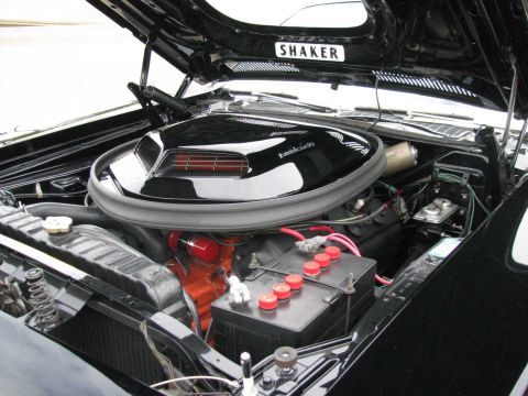 2003 Mercury Marauder - The engine bay features a prominent shaker hood scoop and a V8 engine, with the hood open.