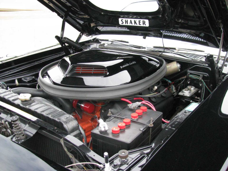 black engine bay, shaker hood scoop, V8 engine, battery, radiator