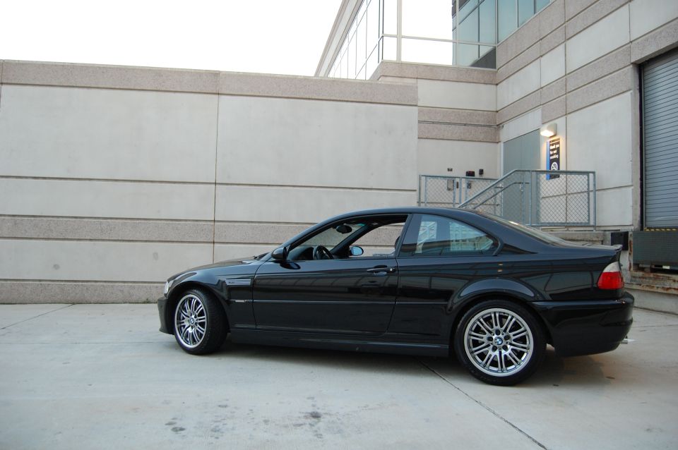 Black BMW M3 coupe parked outdoors.
