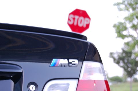 2002 BMW M3 - Rear view of a black 2002 BMW M3, identified by its M3 badge.