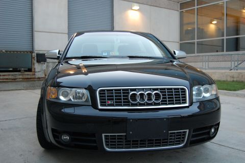 2002 BMW M3 - This black Audi sedan has a distinctive grille with an S4 badge, indicating it is not a 2002 BMW M3.