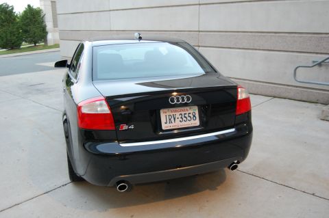 2002 BMW M3 - Rear view of a black Audi S4 sedan parked outdoors.