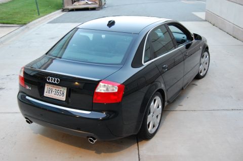 2002 BMW M3 - Rear view of a black Audi sedan, likely a B6 A4 or S4 generation.