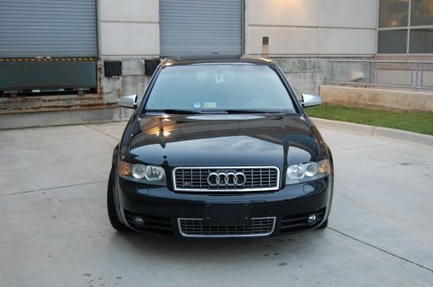 2002 BMW M3 - Front view of a black Audi S4 parked outdoors.