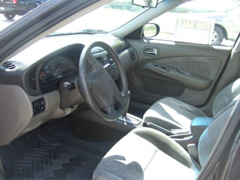 2000 Nissan Sentra - Interior of a 2000 Nissan Sentra, showing the driver's side dashboard and front seats.