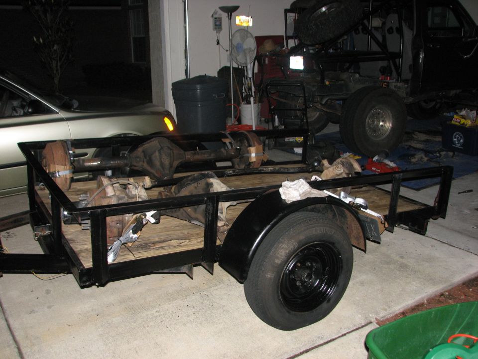 Trailer loaded with axles and differentials