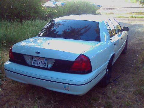 2000 Ford Crown Victoria - This 2000 Ford Crown Victoria is seen from the rear, a California license plate and tinted windows.