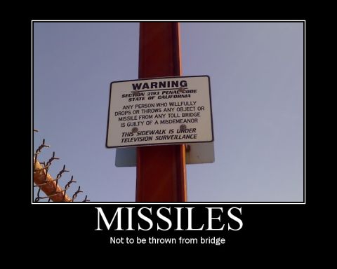 1971 Ford Bronco - Warning sign on a pole about dropping objects from a bridge.
