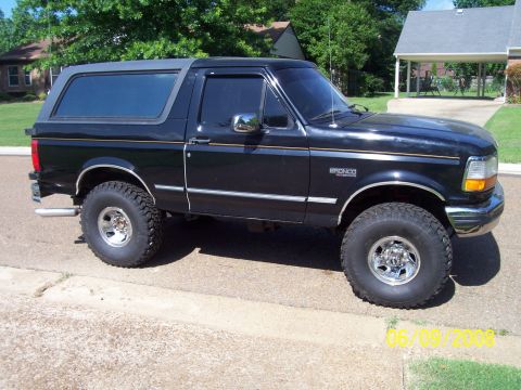 1994 Ford Bronco - 1994 Ford Bronco parked on a residential street.
