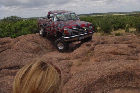 1979 Ford Bronco - This Ford F-150 pickup truck is shown off-roading on a rocky terrain.