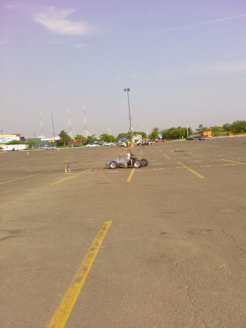 2001 Mercury Grand Marquis - A driver navigates a course marked by cones in a custom-built open-wheel vehicle.