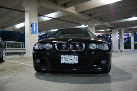 2002 BMW M3 - A black 2002 BMW M3 is parked head-on in a concrete parking garage.