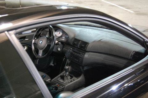 2002 BMW M3 - Interior view of a 2002 BMW M3, the dashboard, steering wheel, and manual shifter.