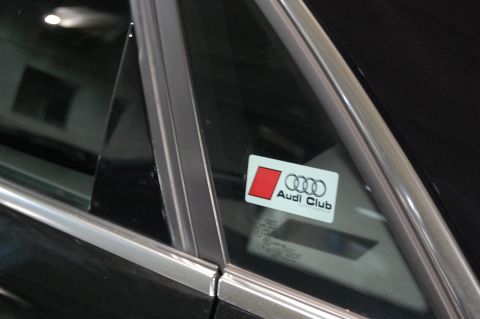 2002 BMW M3 - Close-up of an Audi Club sticker affixed to the glass of a vehicle.