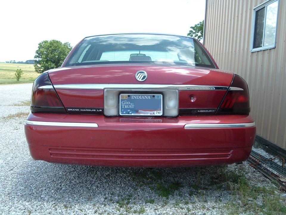 Red Mercury Grand Marquis LS rear view with smoked taillights and Indiana plate