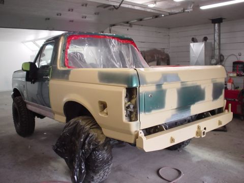 1996 Ford Bronco - This 1996 Ford Bronco is undergoing body repair and is covered in primer and masking tape.