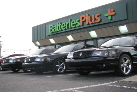 2003 Mercury Marauder - Three black 2003 Mercury Marauders are parked in front of a Batteries Plus store.