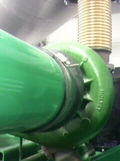 2002 Nissan SE-R - Close-up of a green pipe assembly, possibly part of an industrial or automotive system.