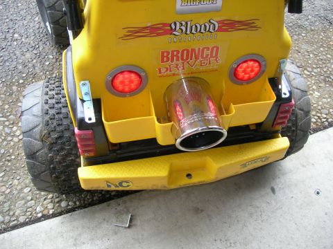 1996 Ford Bronco - This toy ride-on vehicle features a large chrome exhaust pipe and 'Bronco Driver' branding.