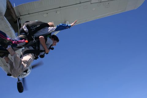 1996 Ford Bronco - Skydivers leap from an airplane during a jump.