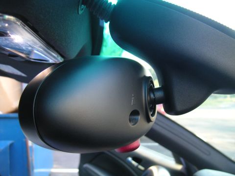 2002 BMW M3 - Interior rearview mirror assembly detail, focus on the housing and mounting mechanism.