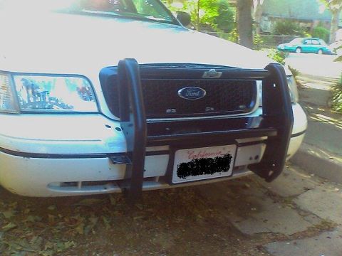 2000 Ford Crown Victoria - Front view of a 2000 Ford Crown Victoria equipped with a black push bar.