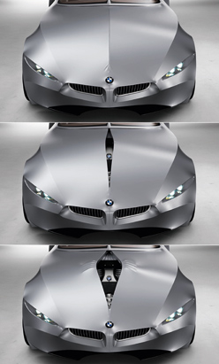 2001 Ford Crown Victoria - A silver BMW concept car is shown from the front in three variations, highlighting its grille and headlights.