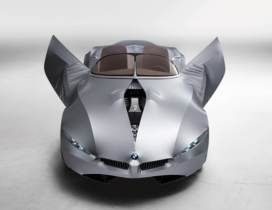Silver concept car with butterfly doors open, BMW badge visible on front