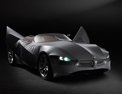 2001 Ford Crown Victoria - This dark concept car features distinctive butterfly doors and a prominent BMW grille.