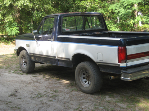 1989 Ford F-150 - This 1989 Ford F-150 pickup truck is shown from the driver's side, three-quarter front view.