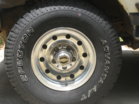 1989 Ford F-150 - A close-up view of the tire and wheel assembly on a 1989 Ford F-150 truck.