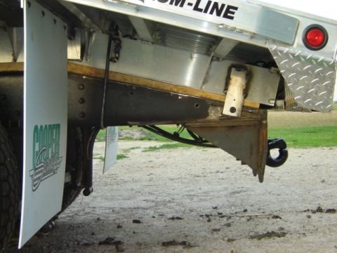 1992 Ford Bronco - Close-up of a trailer hitch and mud flap, with 'COOPER' visible on the flap.