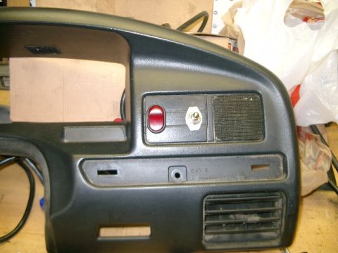 1995 Ford Bronco - Close-up of a vehicle's dashboard section, showing various controls and vents.