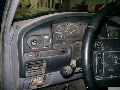 1995 Ford Bronco - Close-up of a truck's dashboard, showing the instrument cluster and steering wheel.