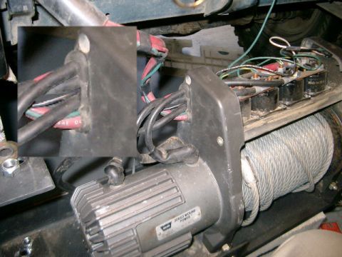 1995 Ford Bronco - Wiring and motor components of a winch are visible, with an inset detailing cable connections.